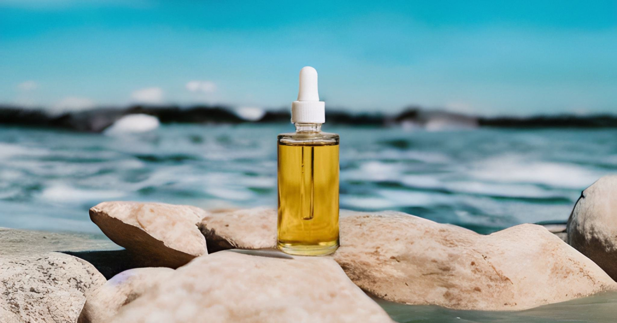A photo of a serum bottle on a rock, beside fast moving water