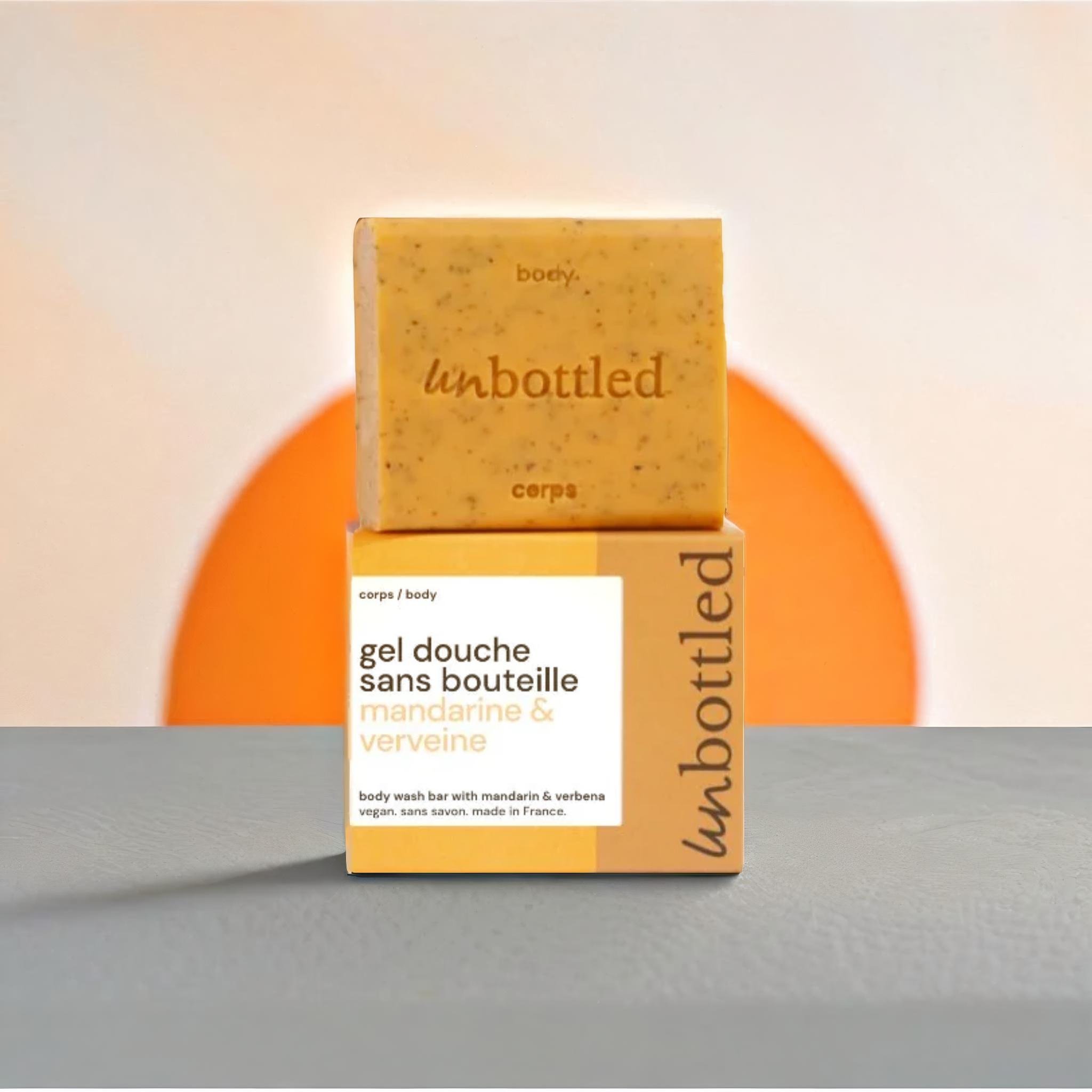 A product standing on a gray table, sun on an orange wall in the background