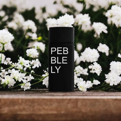 A beauty product with flowers in the background