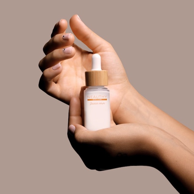 A hand model holding a beauty product