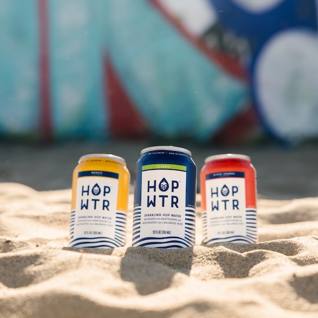 Three cans on the sand of a beach
