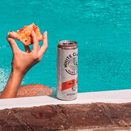 A can drink by the poolside