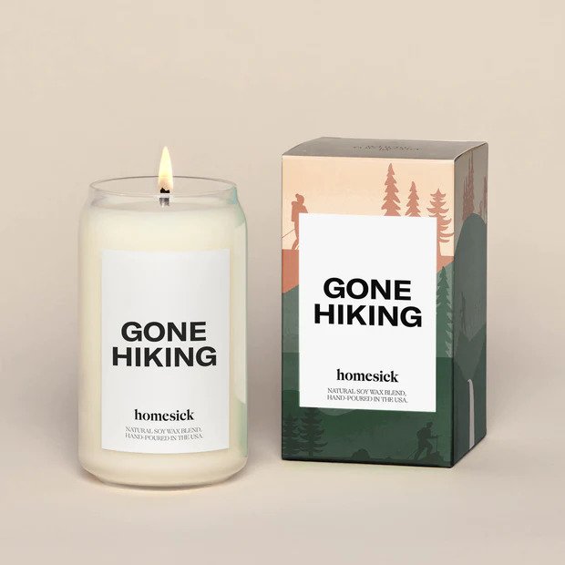 A candle besides its packaging