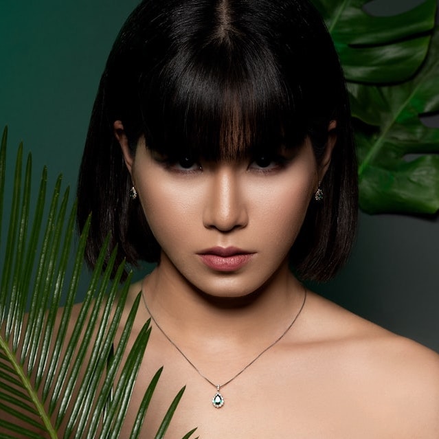 An Asian lady with a pearl necklace