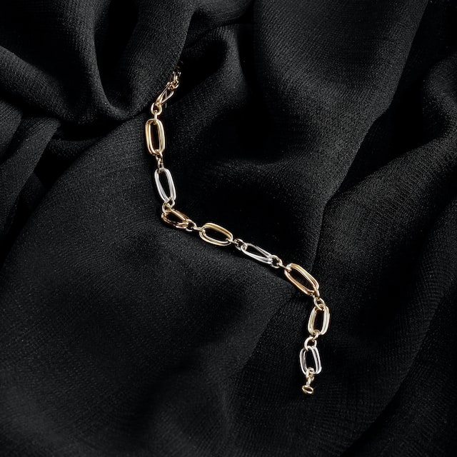 A bracelet on a black cloth