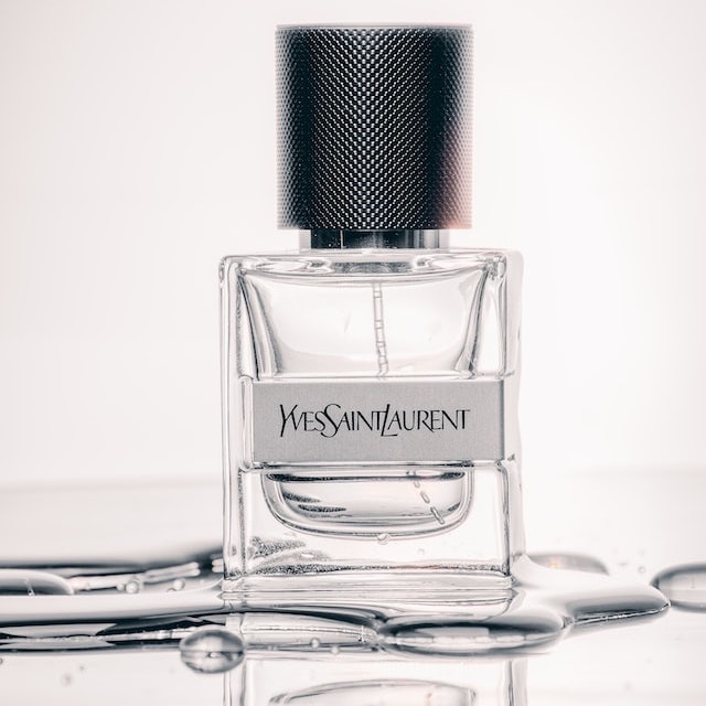 A photo of Yves Saint Laurent perfume and its reflection