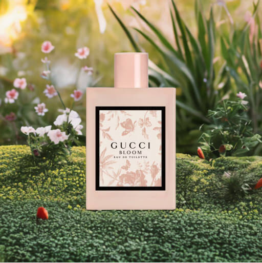 A photo of Gucci Bloom in a magical garden with bright sunlight